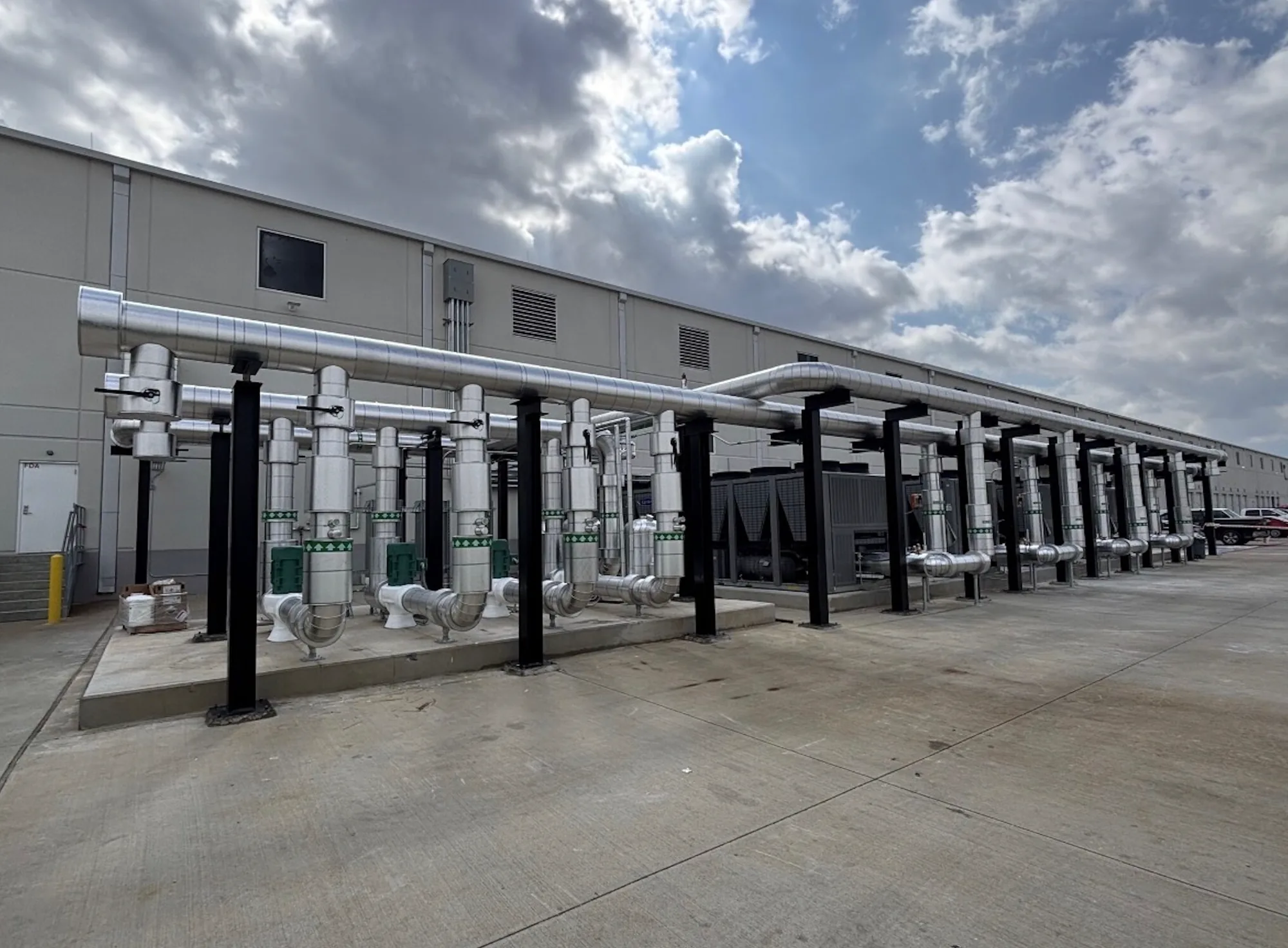 Chilled-water equipment, pumps, and insulated piping installed at a high-tech manufacturing facility in Houston
